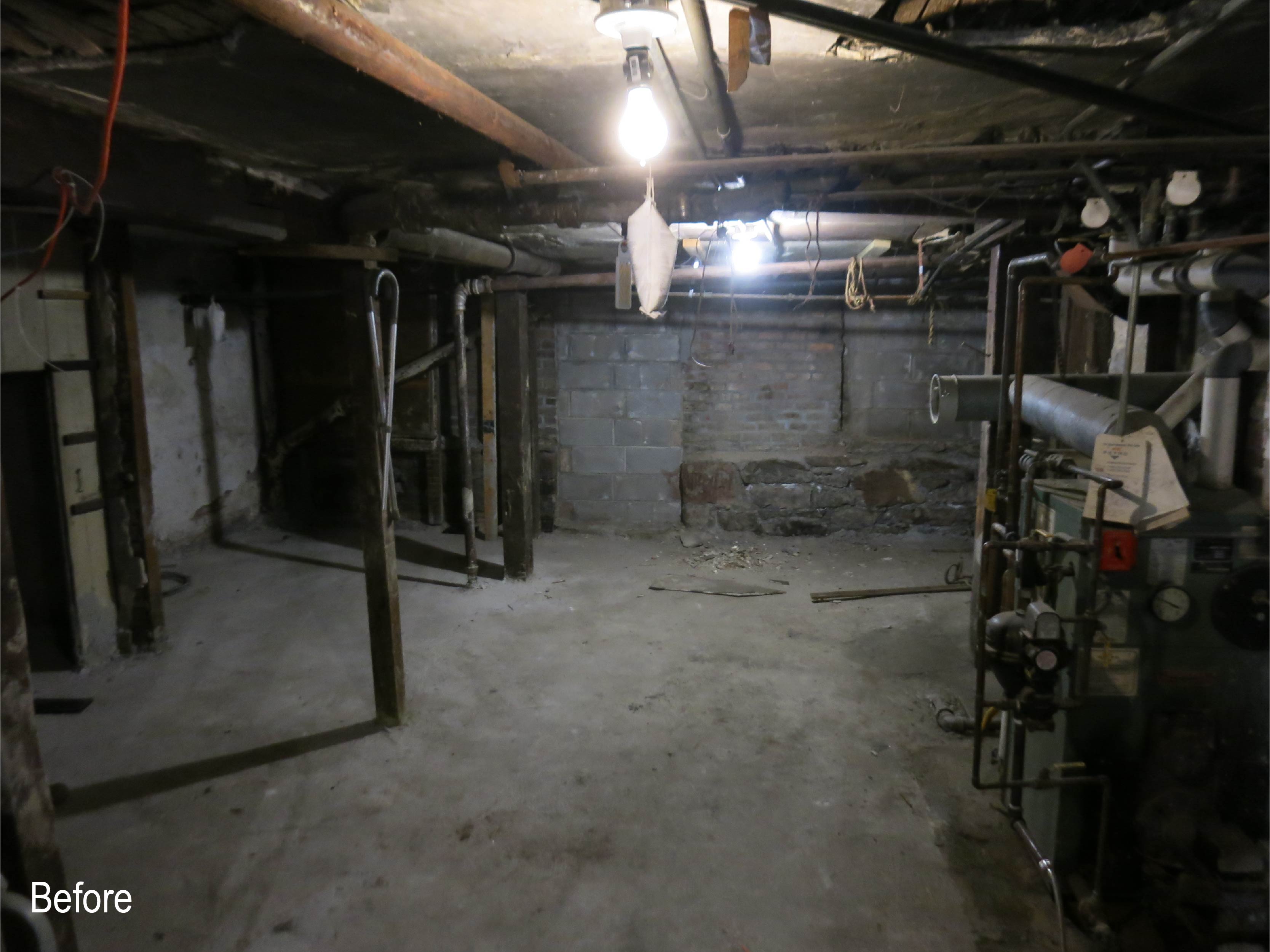 Unfinished basement of a Brooklyn Heights colonnade rowhouse before our renovation.