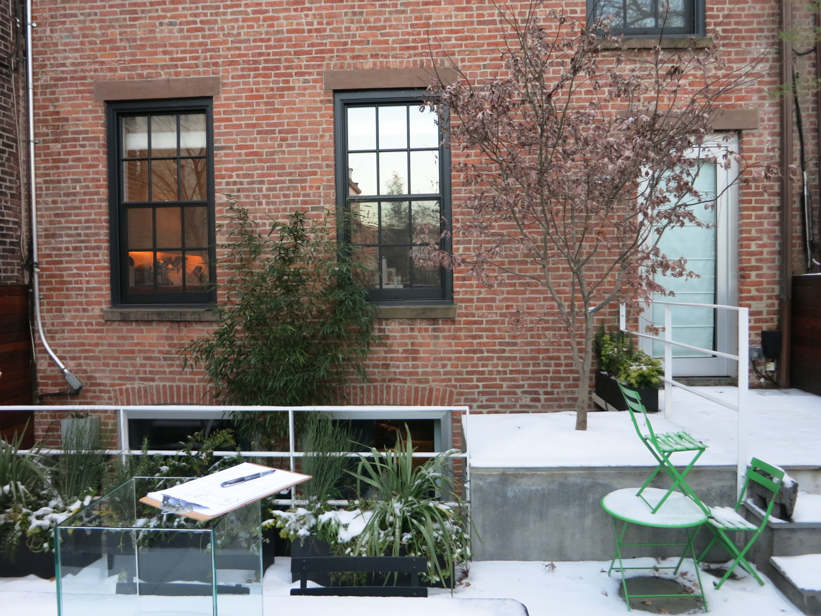 Rear façade of a brick townhouse before our renovation